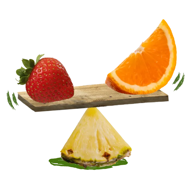 Erdbeere und Orange balancierten auf einer Ananasskala